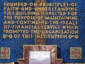 Text block reading "Founded on principles of faith and understanding, this building is erected for the purpose of maintaining and continuing the ideas of financial service which prompted the organization of this institution