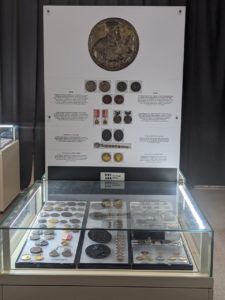 display case with medals